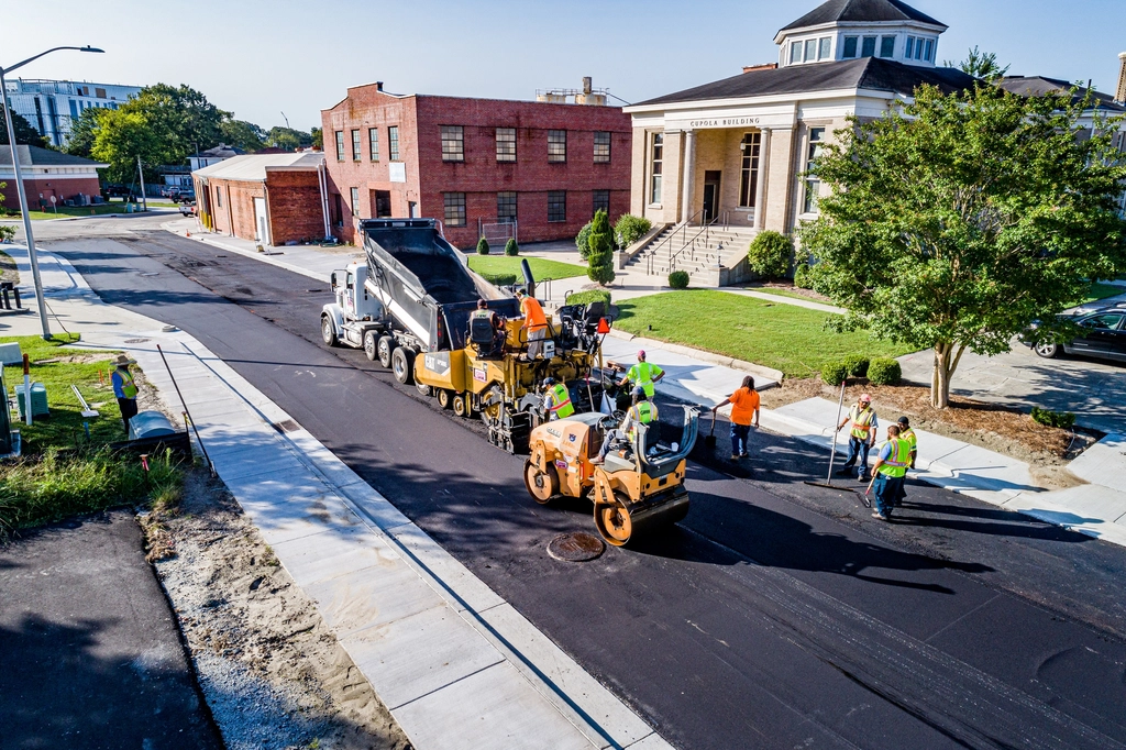 Asphalt paving equipment on a road construction site