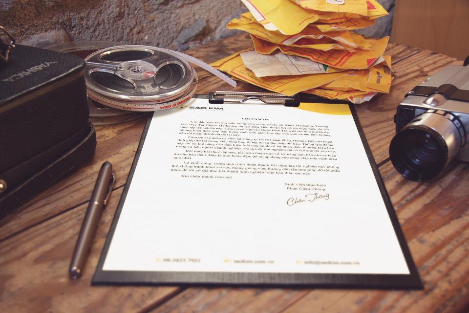 Contract documents and a pen on a desk